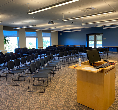 Lecturn facing rows of chairs